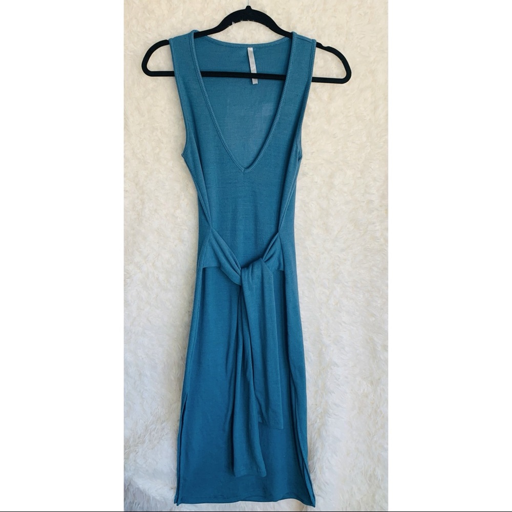 Blue Dress with a cute tie in front! Dress also has cute slits on the sides.